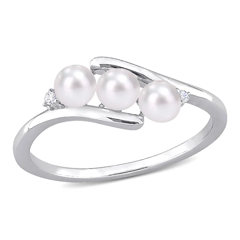 Miadora Sterling Silver Freshwater Cultured Pearl and Diamond Accent 3-Stone Bypass Ring (3.5-4mm) Miadora Sterling Silver Freshwater Cultured Pearl and Diamond Accent 3-Stone Bypass Ring (3.5-4mm)