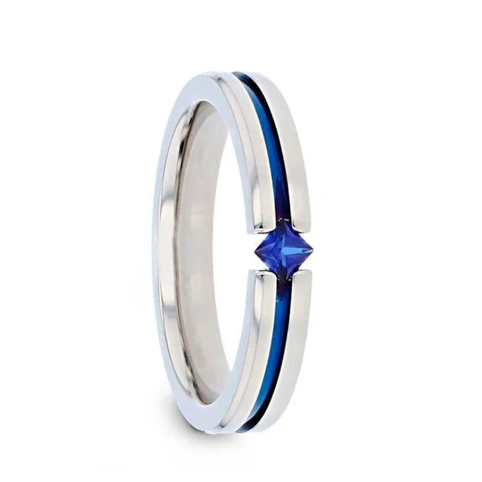 Men's lightweight rings for all - day comfortThorsten NYMERIA Tension Set Blue Sapphire Titanium Band with Blue Stripe - 4mm Men's lightweight rings for all - day comfortThorsten NYMERIA Tension Set Blue Sapphire Titanium Band with Blue Stripe - 4mm