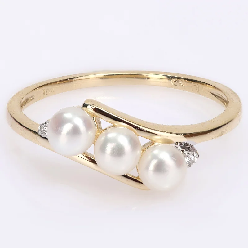 Miadora 10k Yellow Gold Cultured Freshwater Pearl & Diamond Accent 3-Stone Bypass Ring (3.5-4mm) Miadora 10k Yellow Gold Cultured Freshwater Pearl & Diamond Accent 3-Stone Bypass Ring (3.5-4mm)