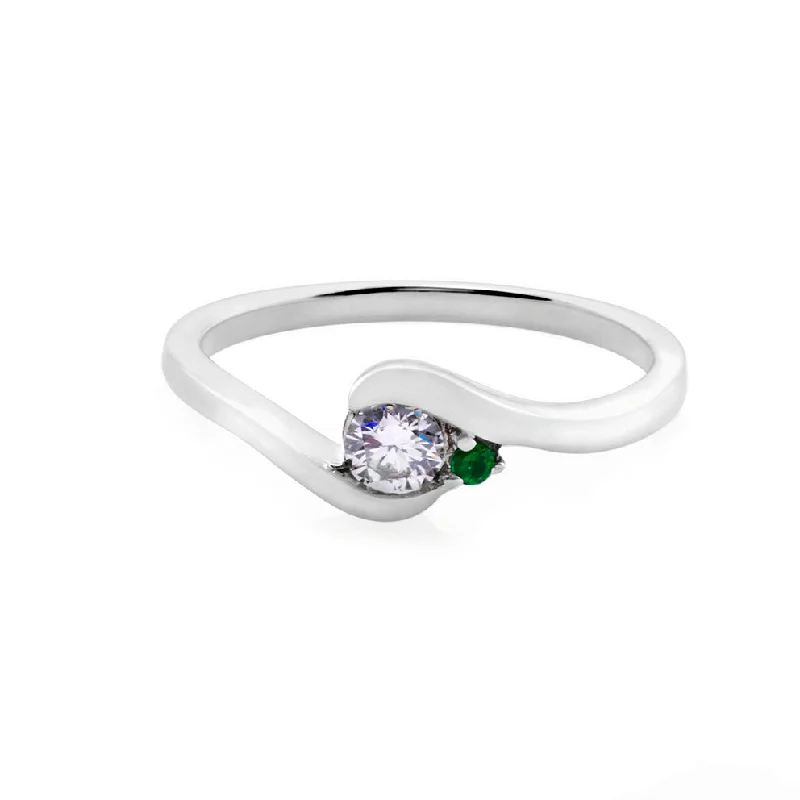 Signature - Design Engagement Rings with a Brand - Exclusive Pattern and Premium DiamondsRound Brilliant Cut Diamond and Emerald Twist Ring in White Gold Signature - Design Engagement Rings with a Brand - Exclusive Pattern and Premium DiamondsRound Brilliant Cut Diamond and Emerald Twist Ring in White Gold