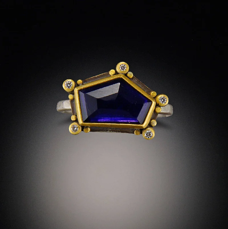 Aquamarine Gemstone Rings in 9K Gold with a Bezel Setting for a Modern and Secure FitGeometric Iolite Ring with Diamonds Aquamarine Gemstone Rings in 9K Gold with a Bezel Setting for a Modern and Secure FitGeometric Iolite Ring with Diamonds