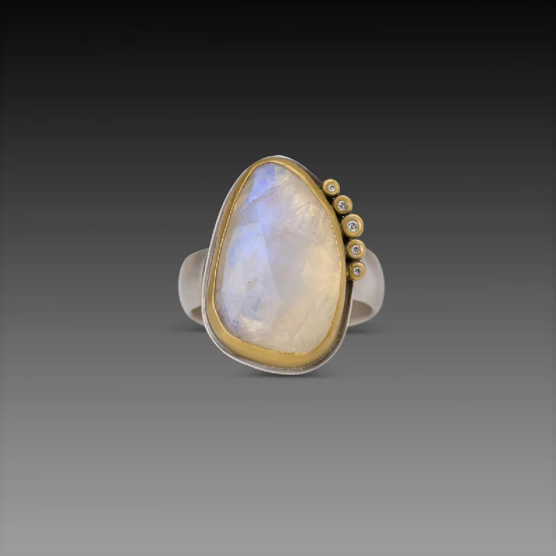Emerald Gemstone Rings Set in Platinum with Filigree Work for a Vintage - Inspired LookOrganic Moonstone Ring with Diamond Arc Emerald Gemstone Rings Set in Platinum with Filigree Work for a Vintage - Inspired LookOrganic Moonstone Ring with Diamond Arc