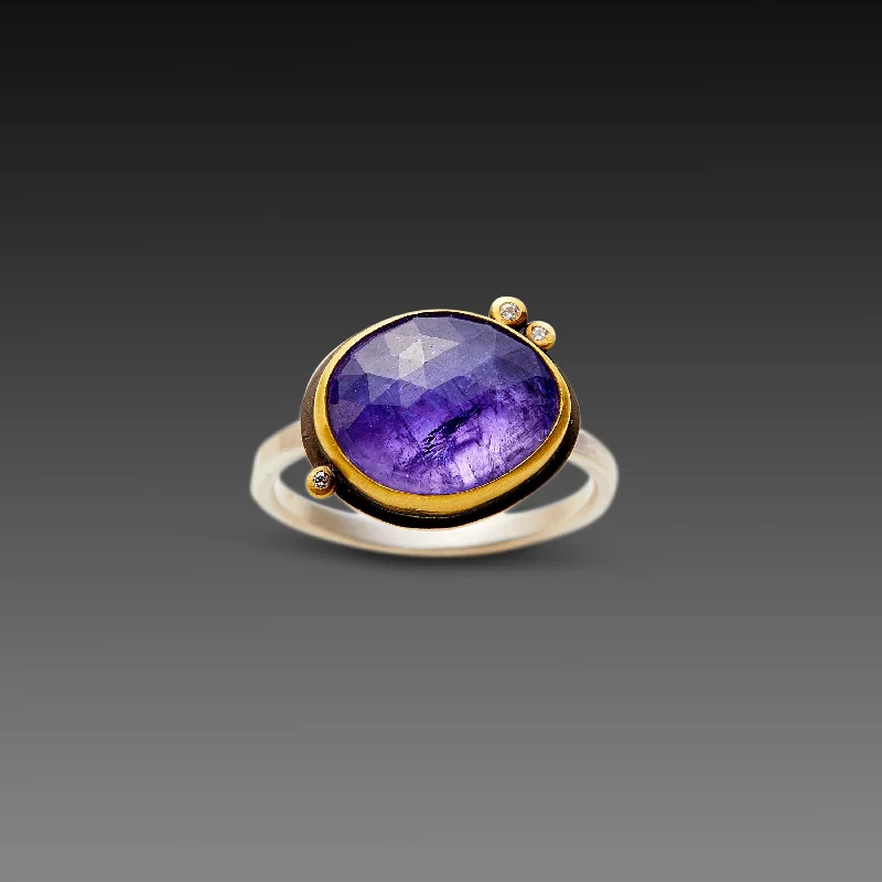 Tanzanite Gemstone Rings in 10K Gold with a Trilogy Design for a Sophisticated GiftRose Cut Tanzanite Ring with Three Diamond Dots Tanzanite Gemstone Rings in 10K Gold with a Trilogy Design for a Sophisticated GiftRose Cut Tanzanite Ring with Three Diamond Dots